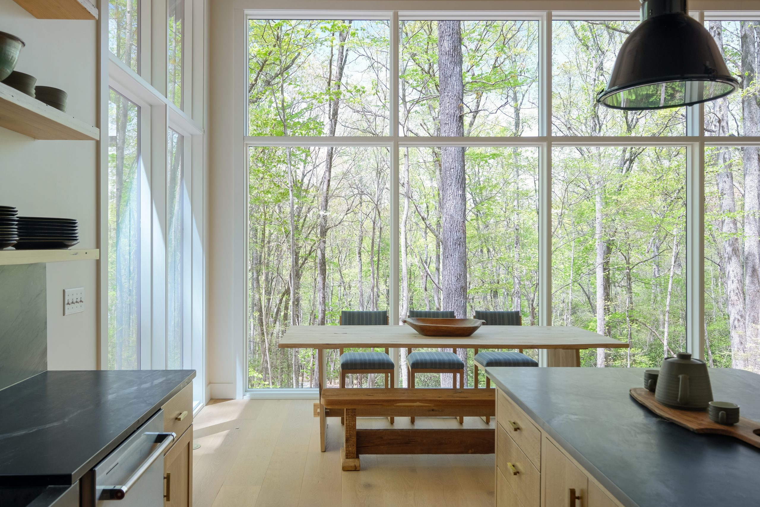Floor to ceiling windows inside of this asheville home - Barndominium house design