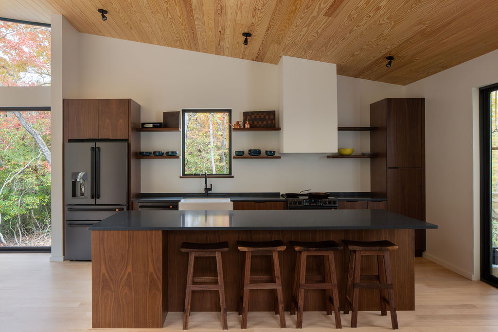 Contemporary timber frame mountain home in Asheville featuring open-concept living, glass facade, and seamless indoor-outdoor flow