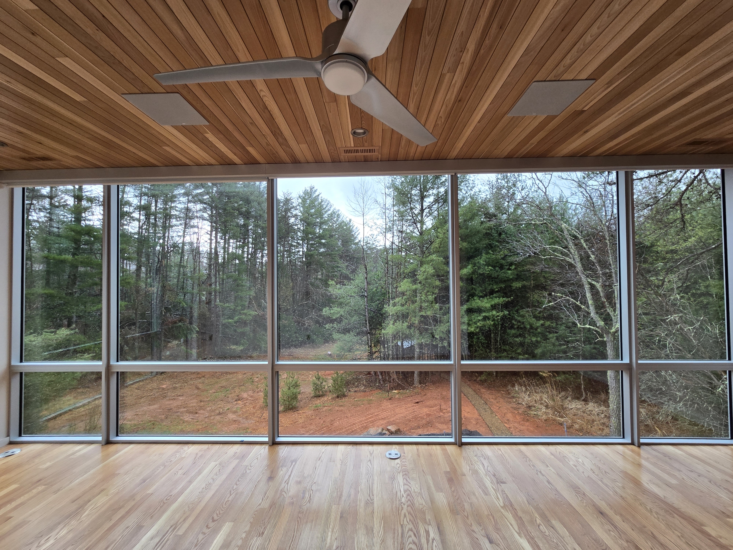 Home with floor to ceiling picture windows overlooking the blue ridge mountains